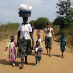 Kenya_MnD_volunteer and children with sunglasses